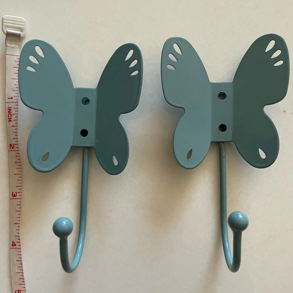 Two butterfly shaped wall hooks